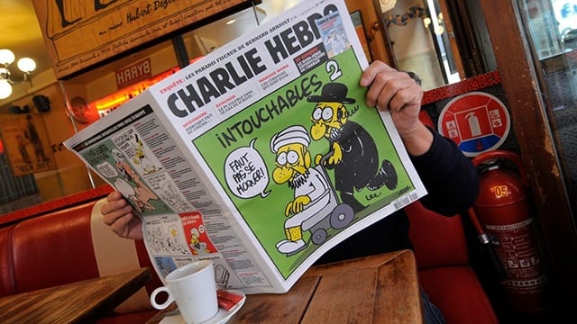 Charlie Hebdo magazine in café